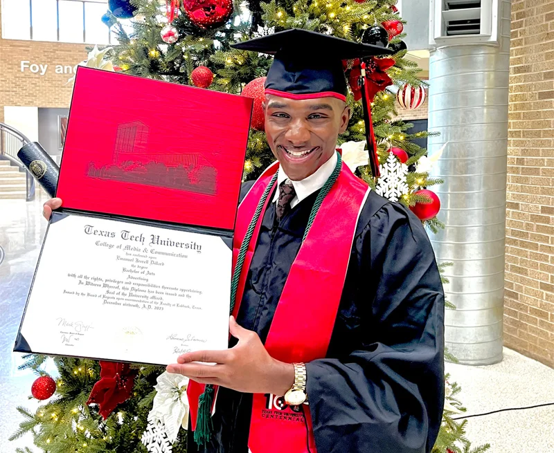 The Bridge Homeless Recovery Shelter, new graduate from Texas Tech University, holding diploma.